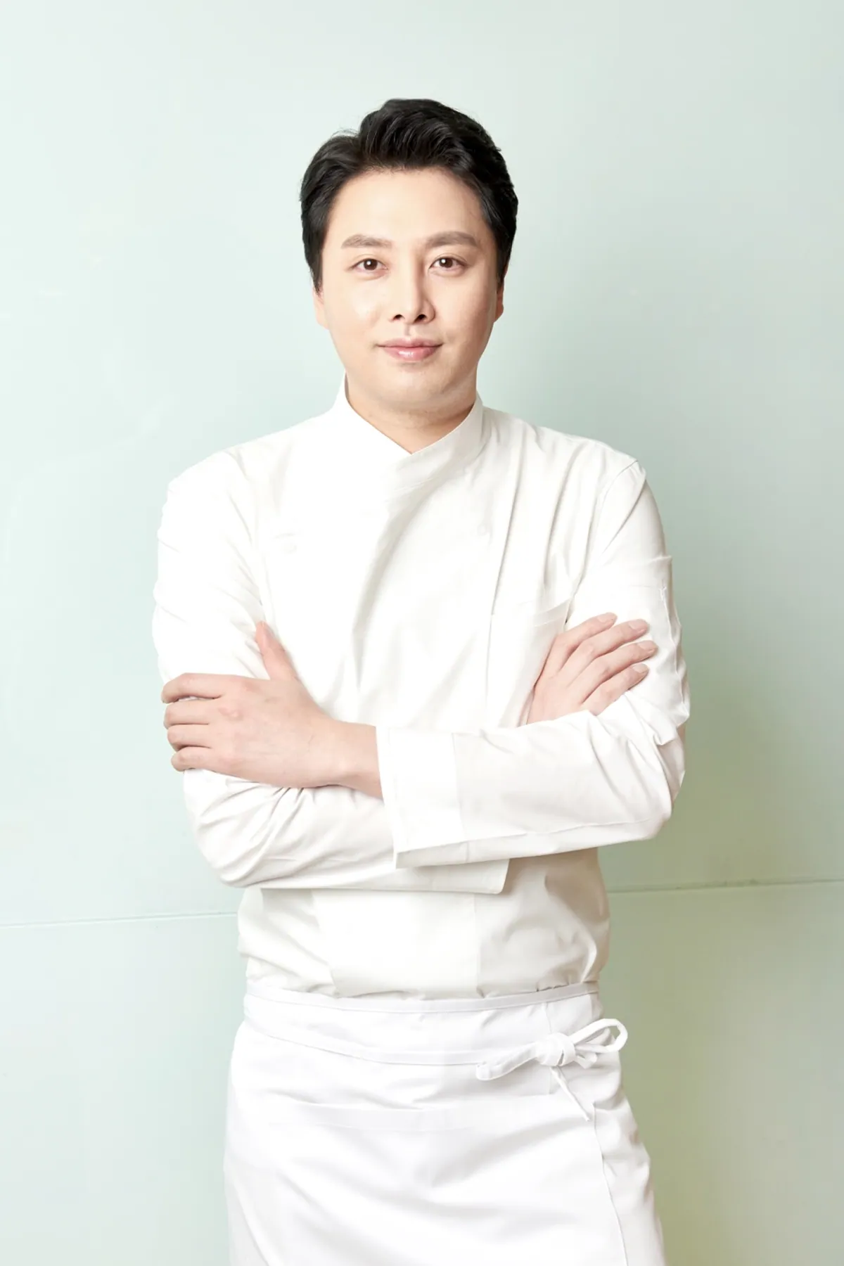 Black-and-white portrait of Owner Chef Joochun Jung (Tony)